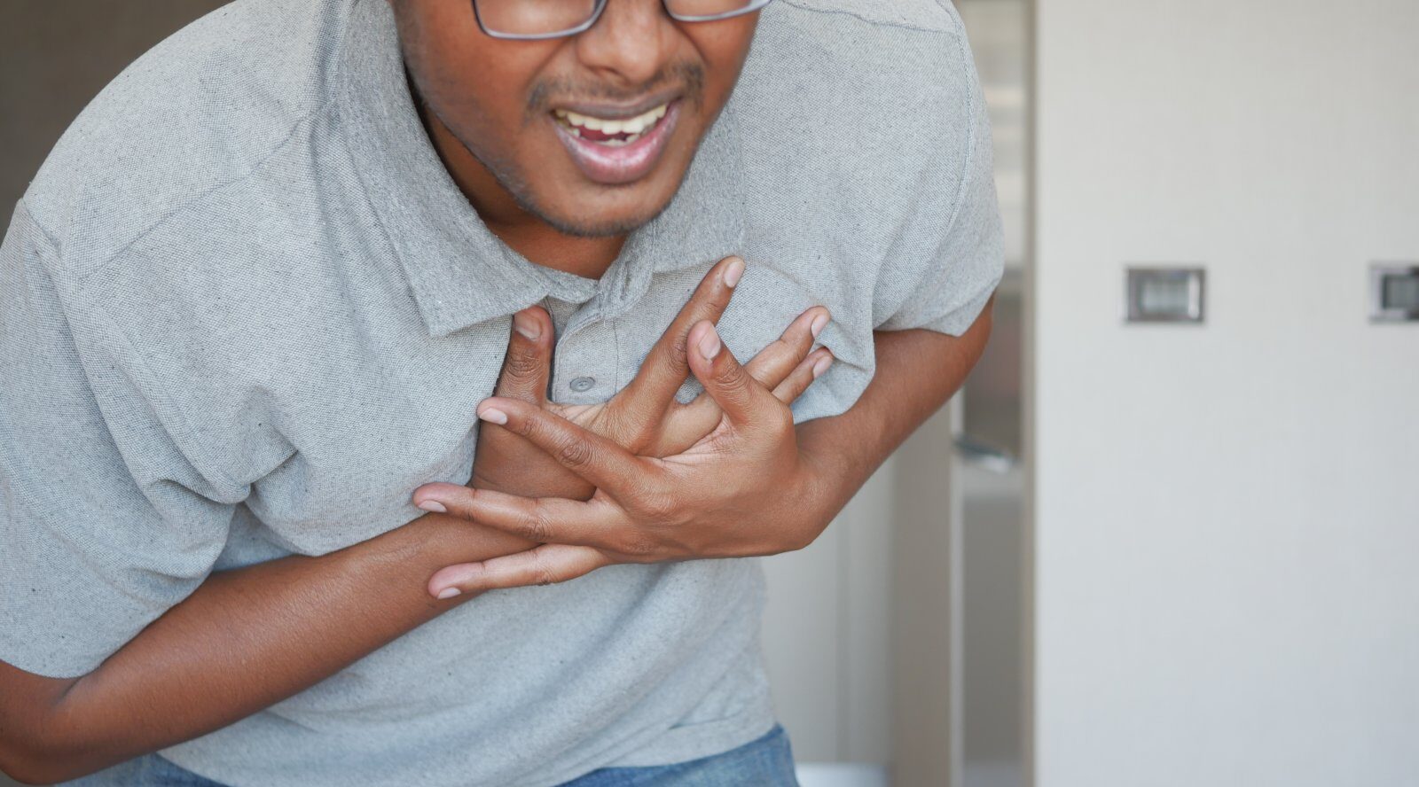 young man suffering pain in heart and holding ches 2024 02 27 00 31 53 utc e1732525620214